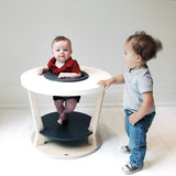 This smart design changes from a baby activity center to a toddler play table to a kid's table. Wooden design disassembles easily and stows neatly away until next time. This furniture piece is a beautiful addition to any modern nursery. Toys can be purchased to keep your little one entertained!